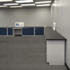 18'x19' blue L-shaped laboratory cabinets with two desk cutouts