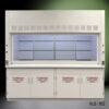 Large white laboratory fume hood. It features a wide, clear sash window that can be moved up and down to access the work area. Below the hood, there are cabinets with safety labels reading "FLAMMABLE KEEP FIRE AWAY," indicating that the cabinets are used for storing flammable materials. The fume hood has ventilation grilles at the top, suggesting that it is designed to protect lab personnel from exposure to hazardous fumes.