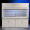 White laboratory fume hood. This fume hood features a large frontal glass sash that is raised to show the spacious interior, with shelves for placing chemicals or equipment. The hood is fitted with ventilation grilles at the top, indicating it is designed to exhaust hazardous fumes away from the user. Below the fume hood, there are two sets of double-door cabinets for storage. This type of equipment is commonly used in scientific research to provide a safe environment when working with volatile substances.