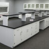 16' x 4' white laboratory cabinet island with center shelf.