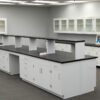 16' x 4' white laboratory cabinets island. Center shelf centered across black countertop.