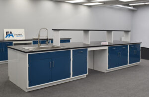 16' blue laboratory island with center shelf and sink.