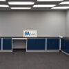 18'x19' blue L-shaped laboratory cabinets with two desk cutout