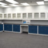 18' x 20' blue laboratory cabinets with black countertop and 14'x19' wall units.