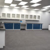 18' x 20' blue laboratory cabinets with black countertop and sink, and 14'x19' wall units.