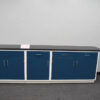 Blue laboratory cabinets with varied door and drawer combinations.